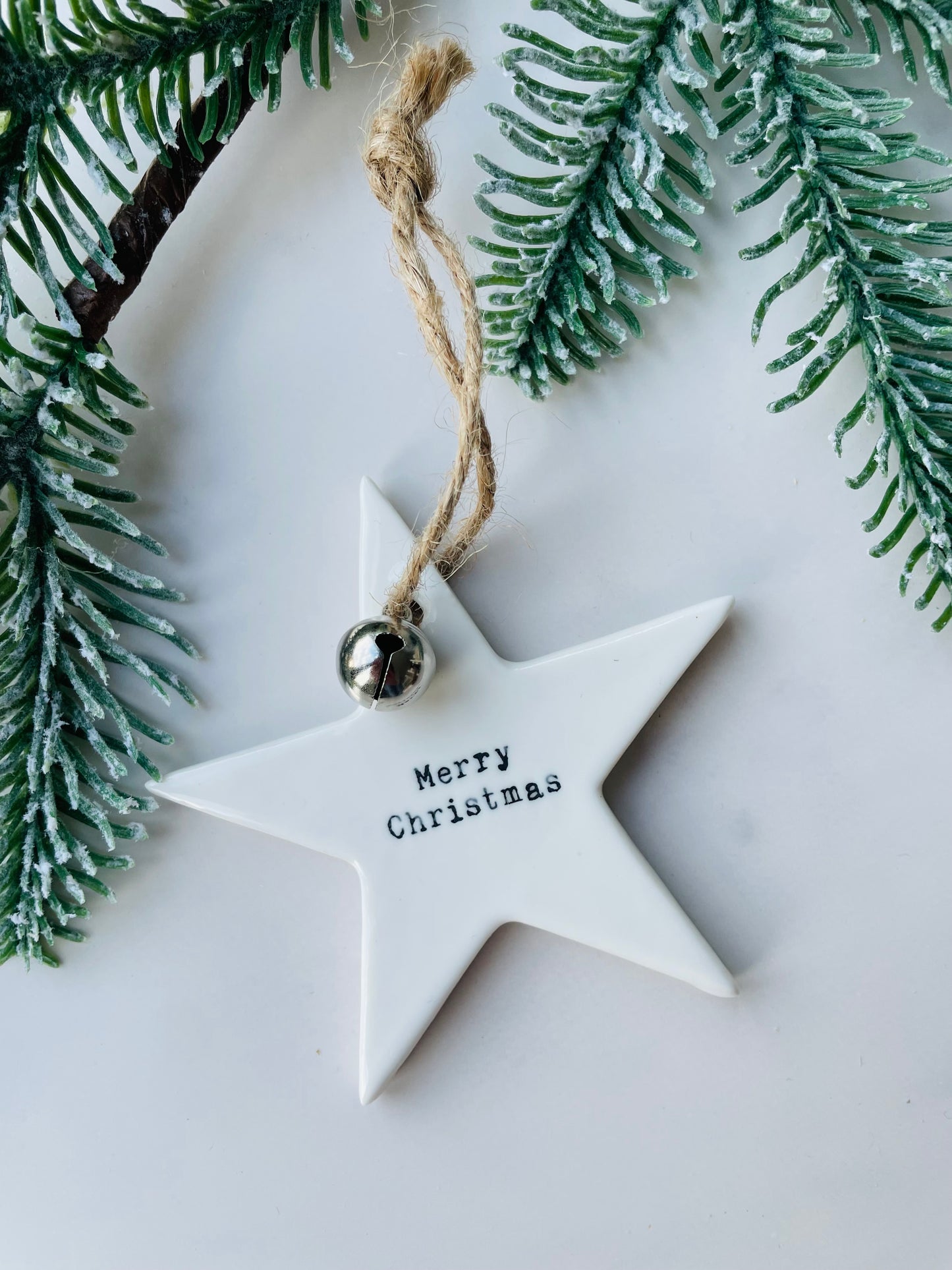 A beautifully embossed 'Merry Christmas' star decoration to hang on the tree. 