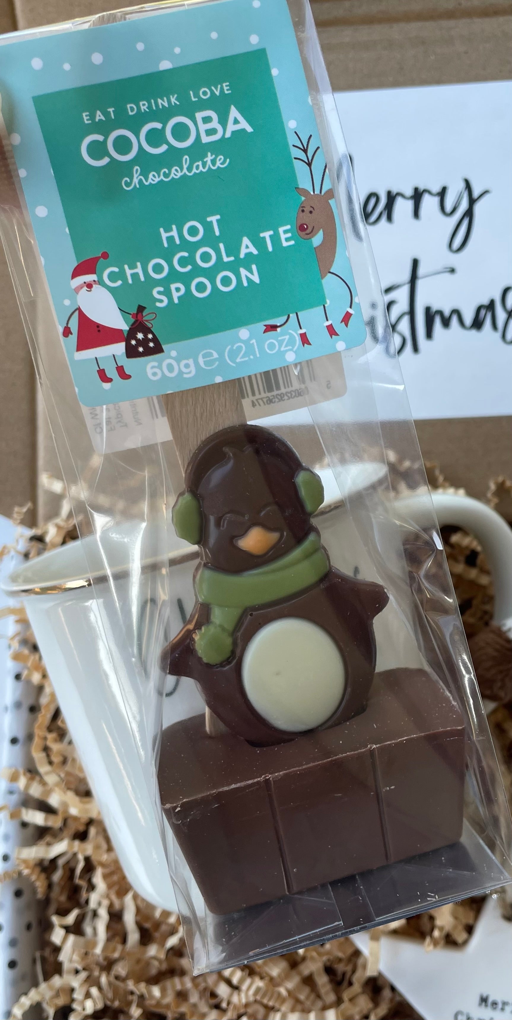 Hot chocolate spoon. penguin with a green scarf. 