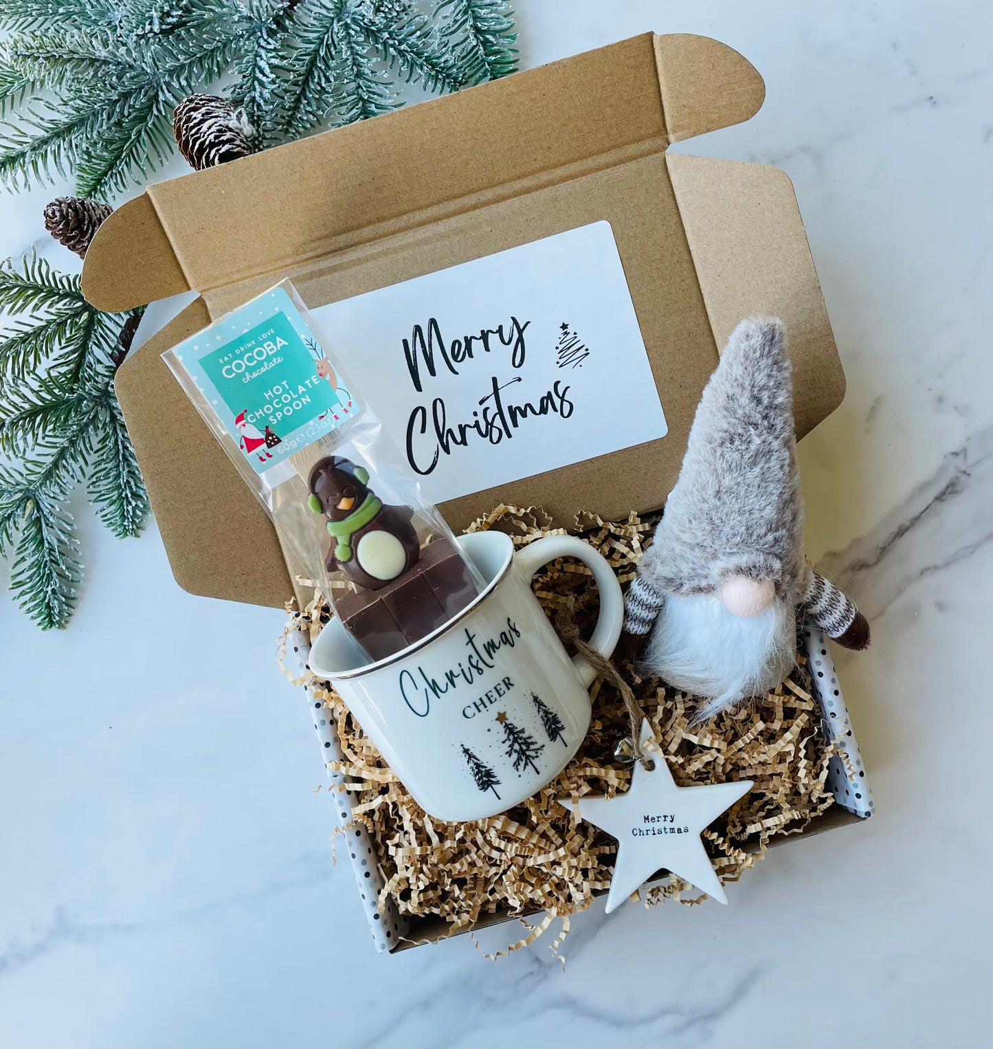 Christmas Gift Box containing, festive mug, penguin hot chocolate spoon, Star Christmas Tree Decoration, Adorable Gonk. Packed and ready to gift