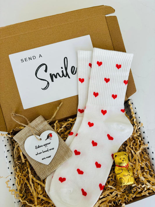 Thinking of you at Christmas Gift Box, containing 'Robins appear when loved ones are near' tree decoration, white socks with red hearts & a Lindt Gold Bear. 